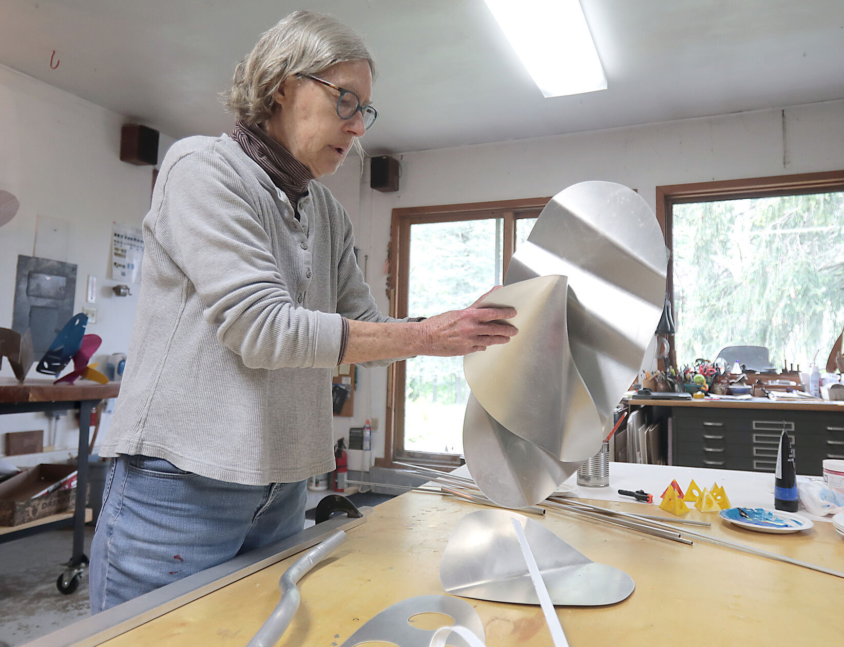 Andree Valley working on aluminum sculpture